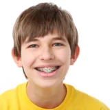 boy smiling with his braces